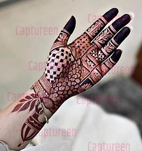 mehndi designs of peacock on hand